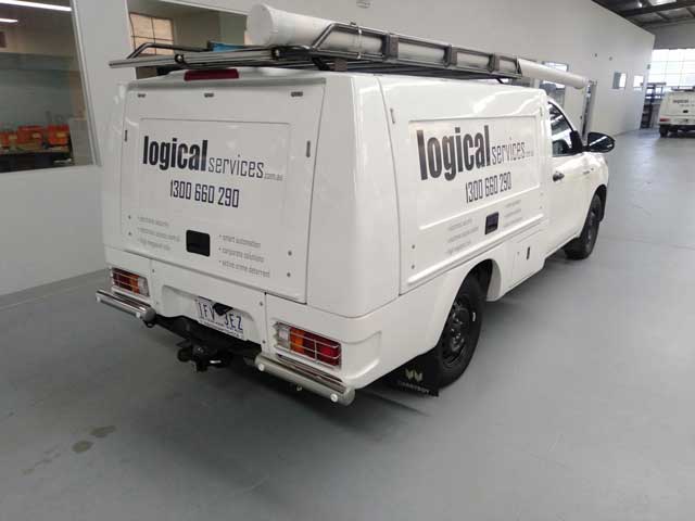 White Logical Services van parked inside business warehouse.